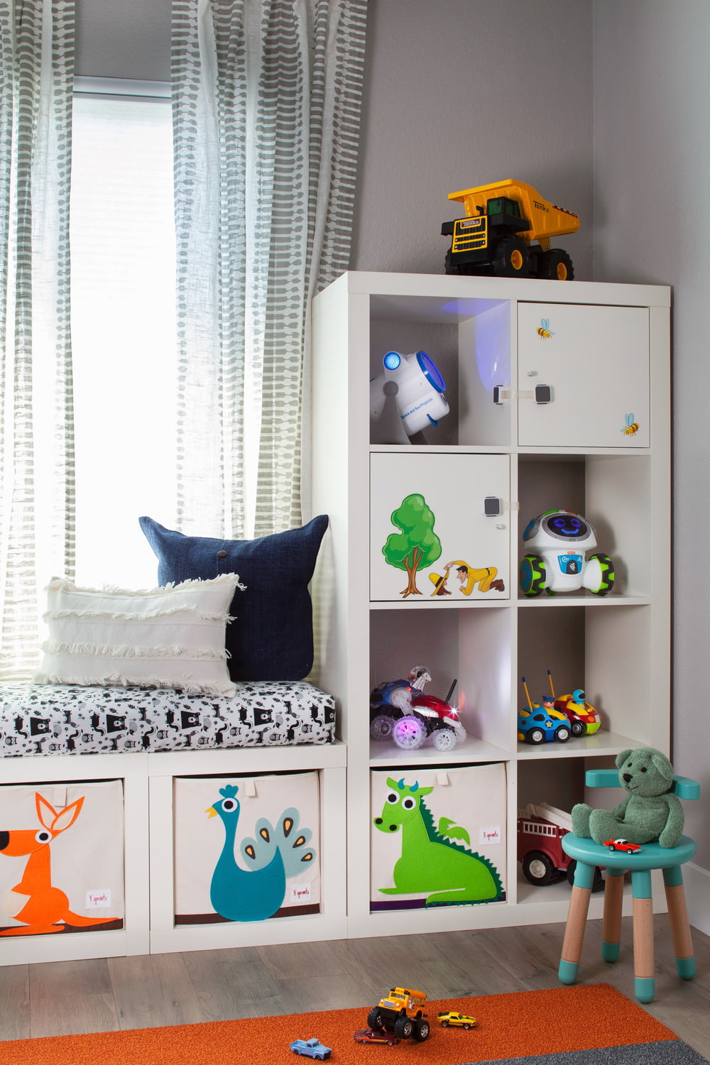 a child's room with a bookcase and toys