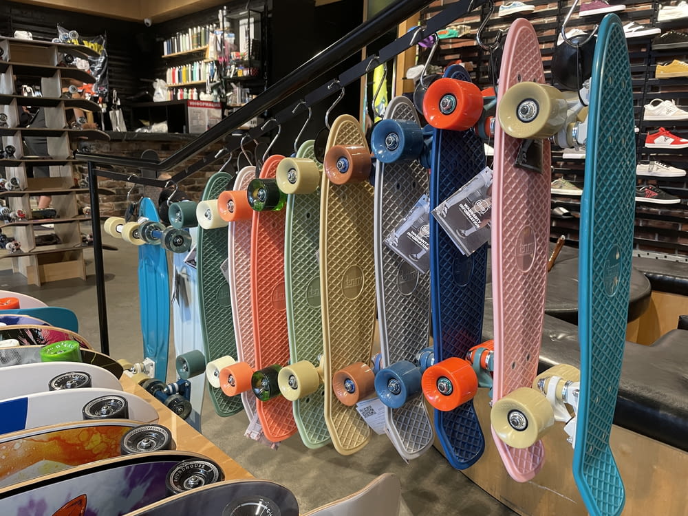 a row of skateboards on display in a store