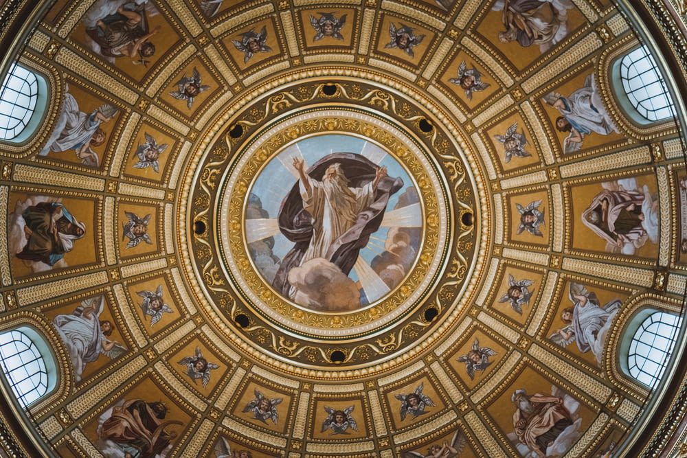 a ceiling with a painting of jesus on it