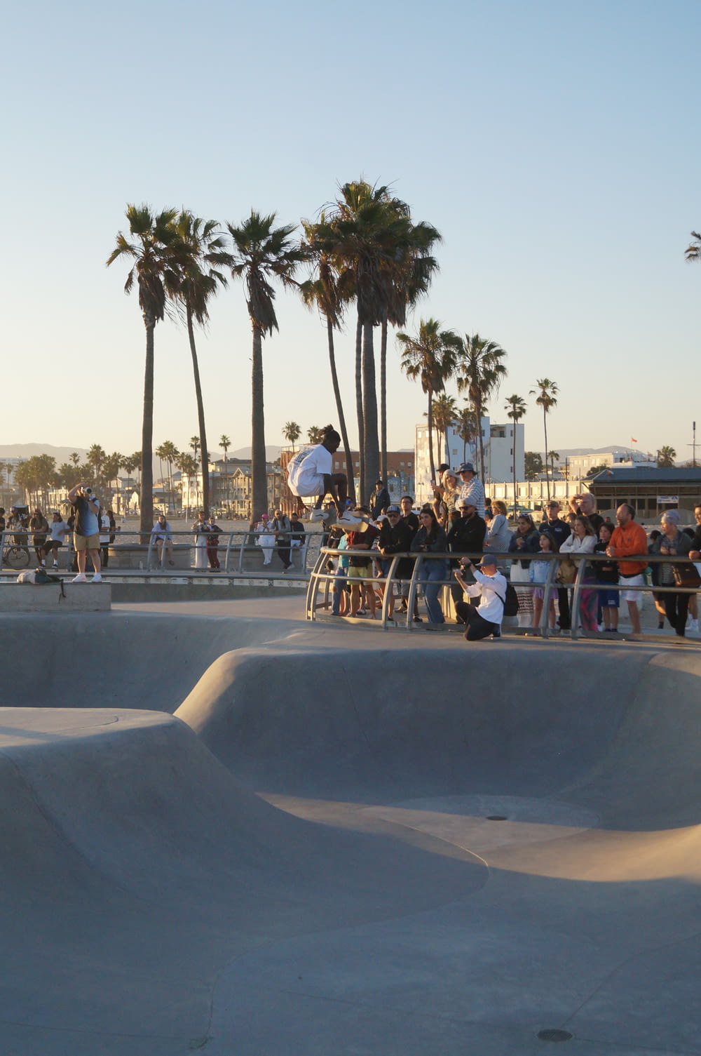 a group of people sitting at a skate park