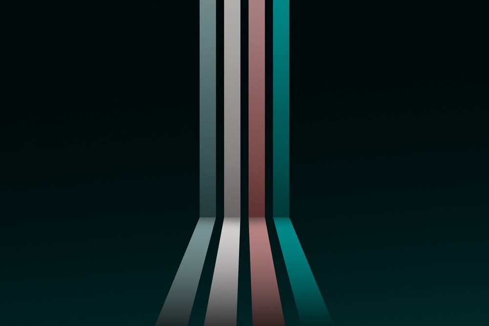 a group of multicolored lines on a black background