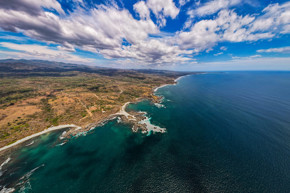 an aerial view of the ocean and coastline