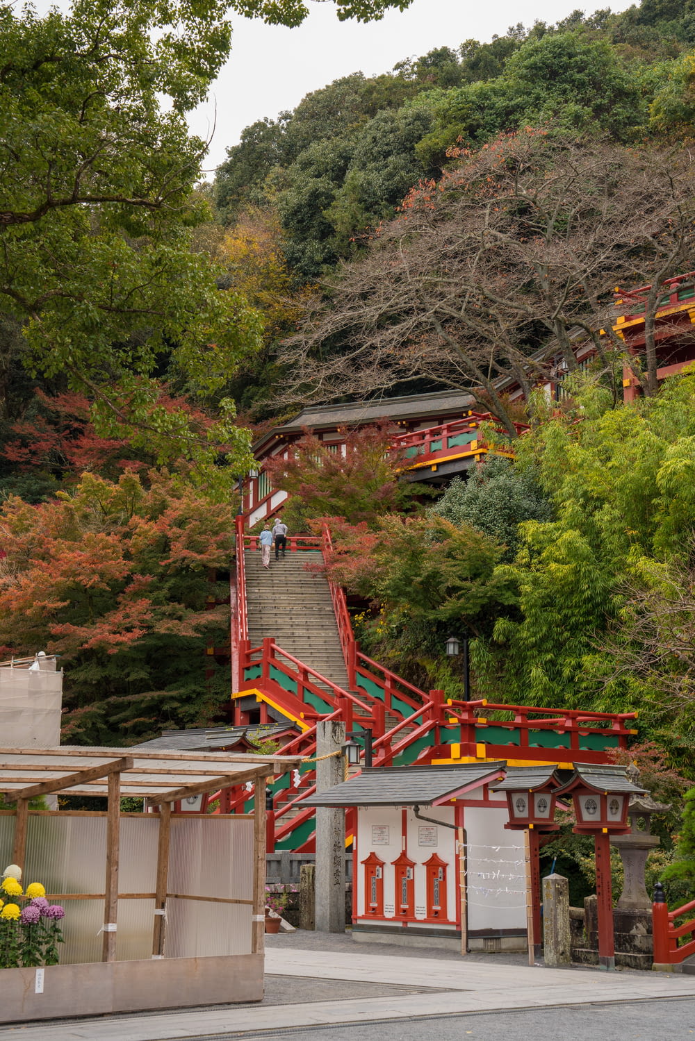 a large hill with a red and yellow staircase going up it