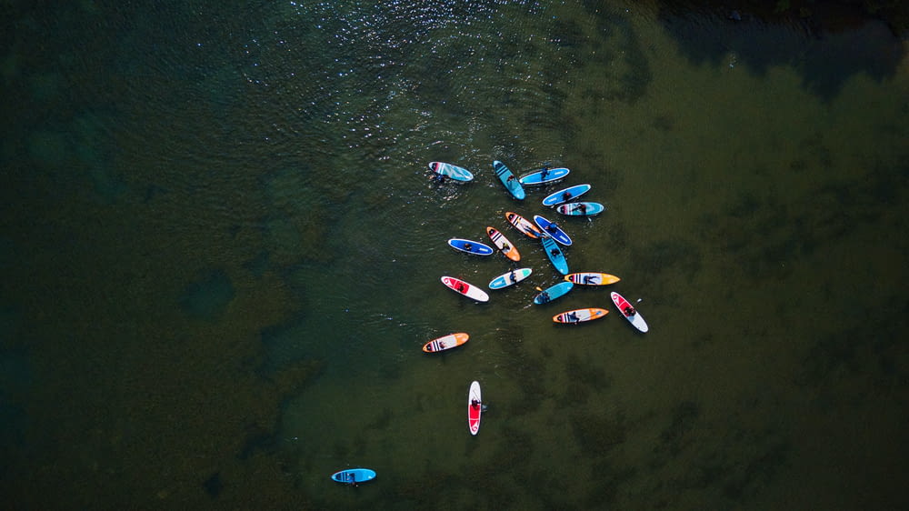 a group of kayaks floating on top of a body of water