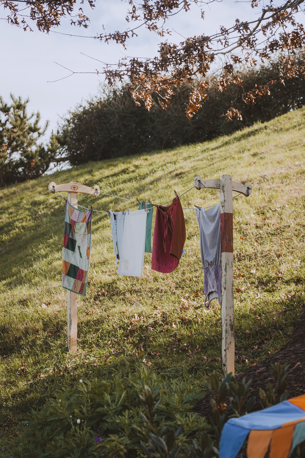 clothes hanging on a clothes line in the grass