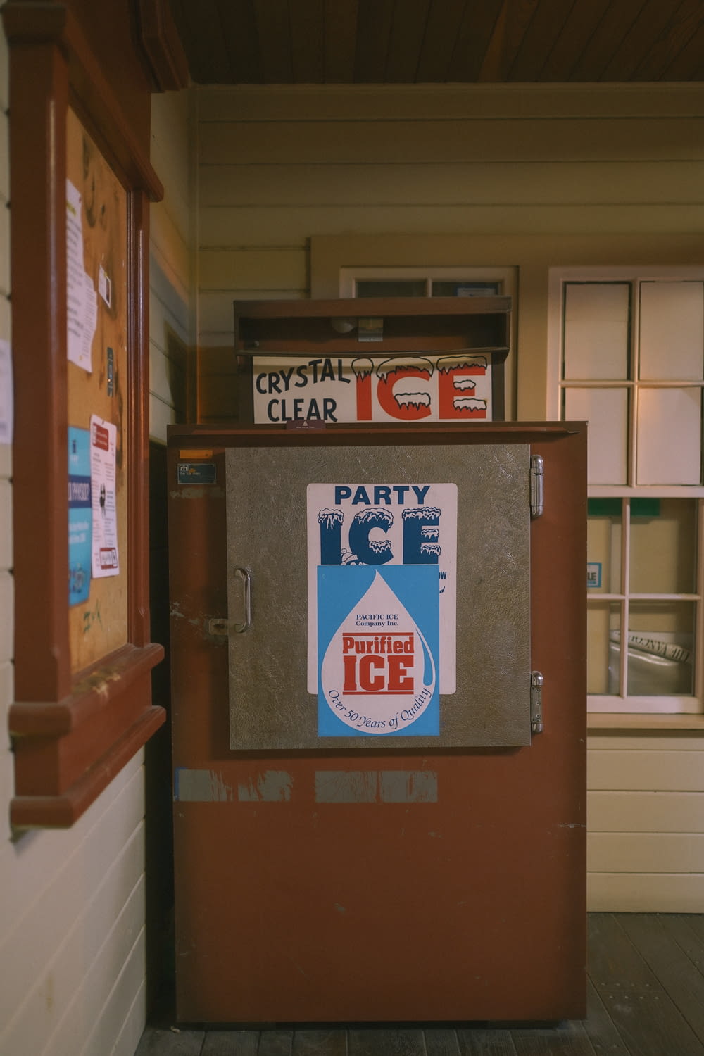 an old ice machine with a party ice sticker on it