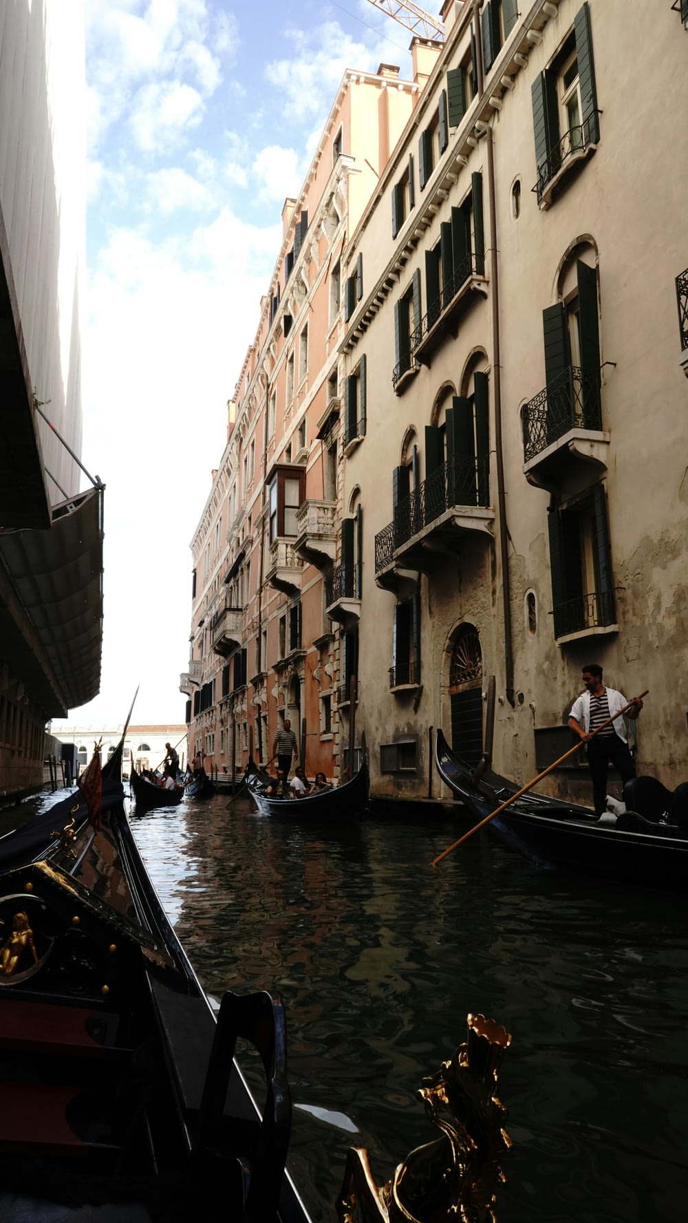 a gondola ride going down a canal in a city