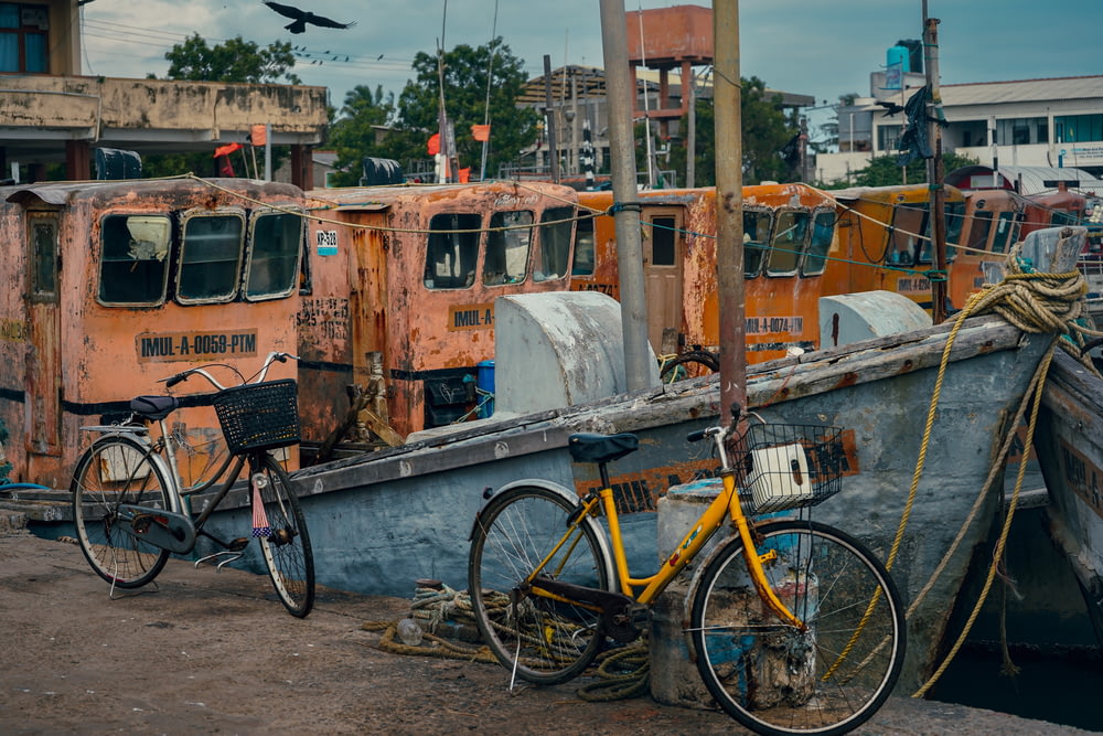 a yellow bicycle parked next to a boat