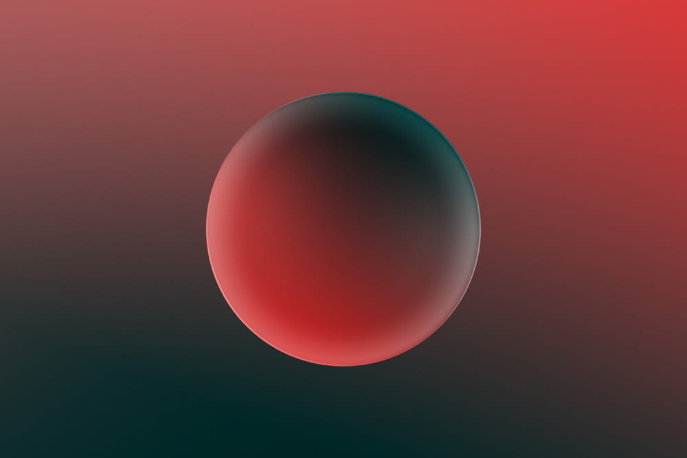 a red and black background with a round object in the center