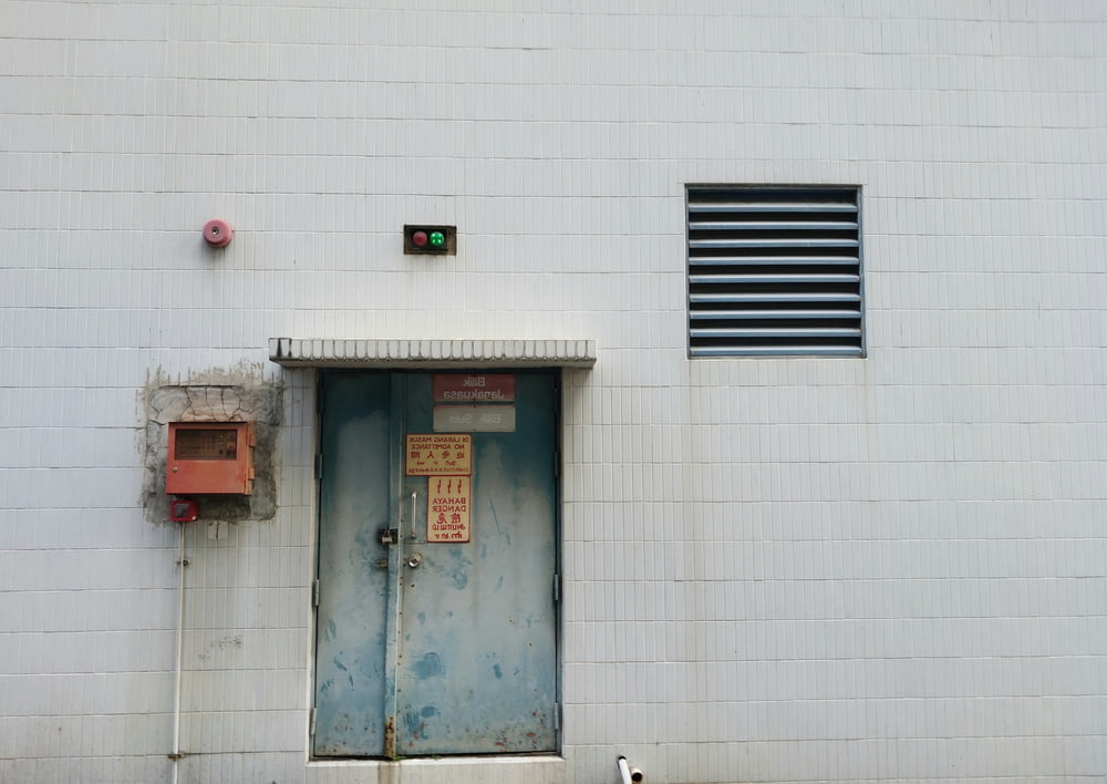 a dog is standing in front of a door