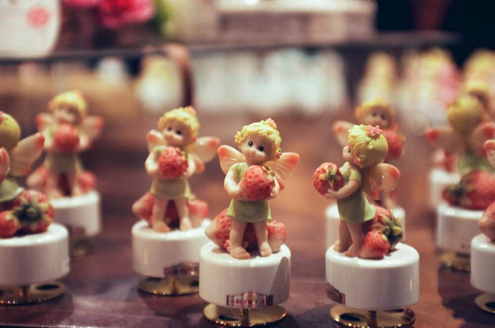 a group of little figurines sitting on top of a table