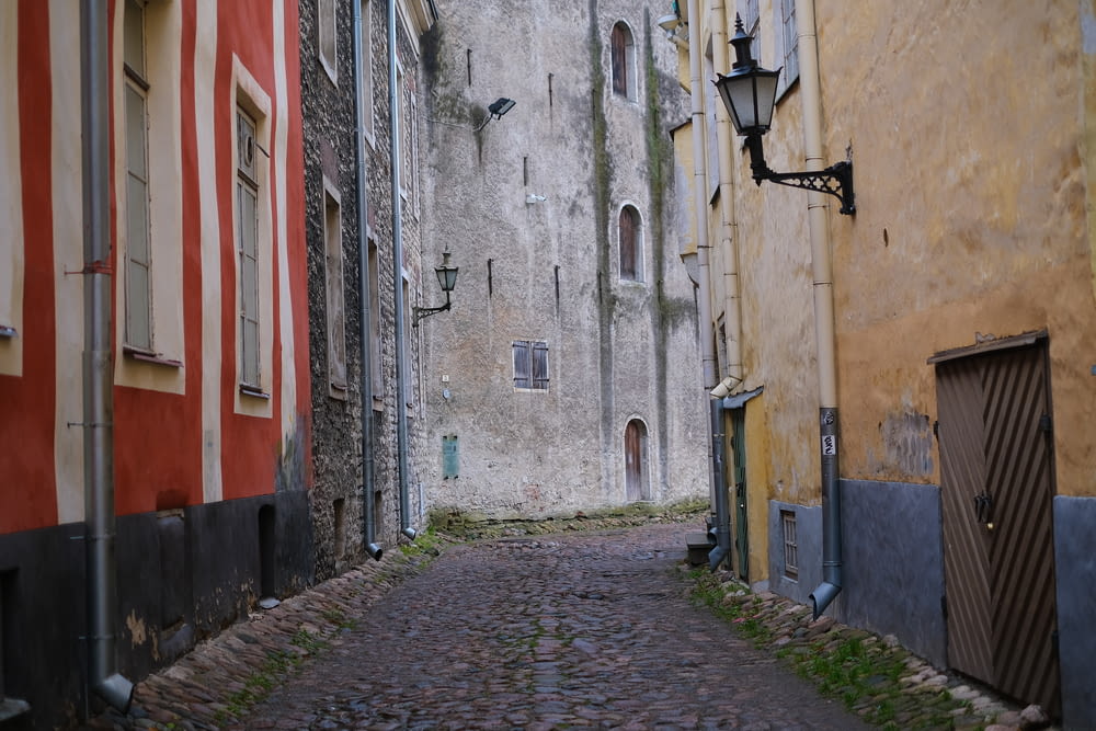 a narrow cobblestone street in an old european city