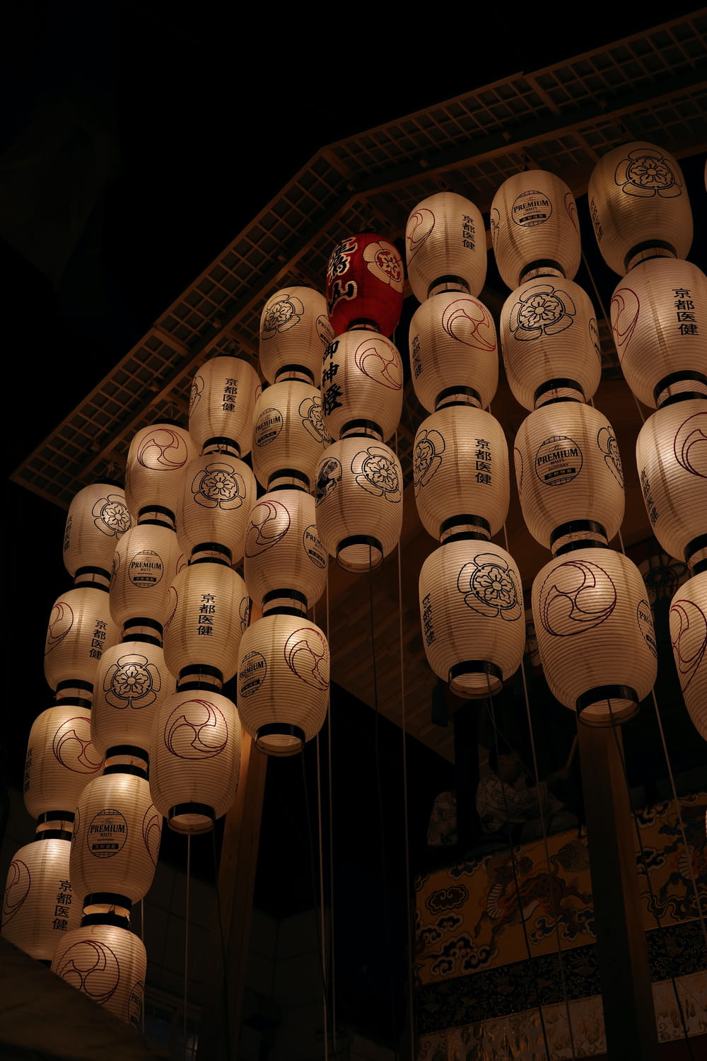 a number of lanterns hanging from a ceiling