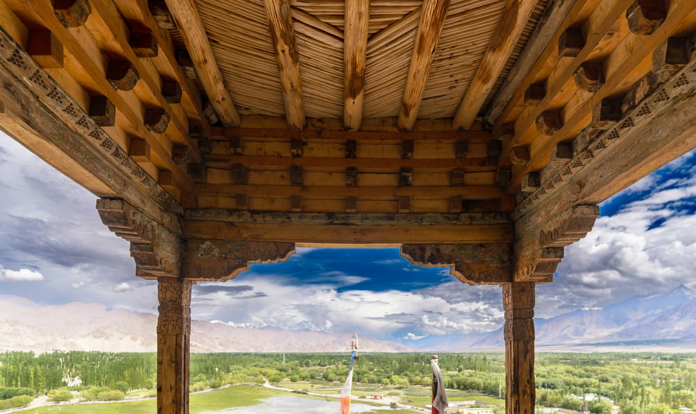 a wooden structure with a view of a valley