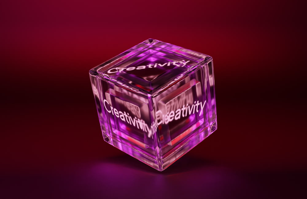 a purple cube with the words creativity written on it