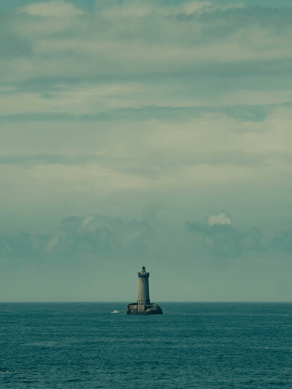 a light house in the middle of the ocean