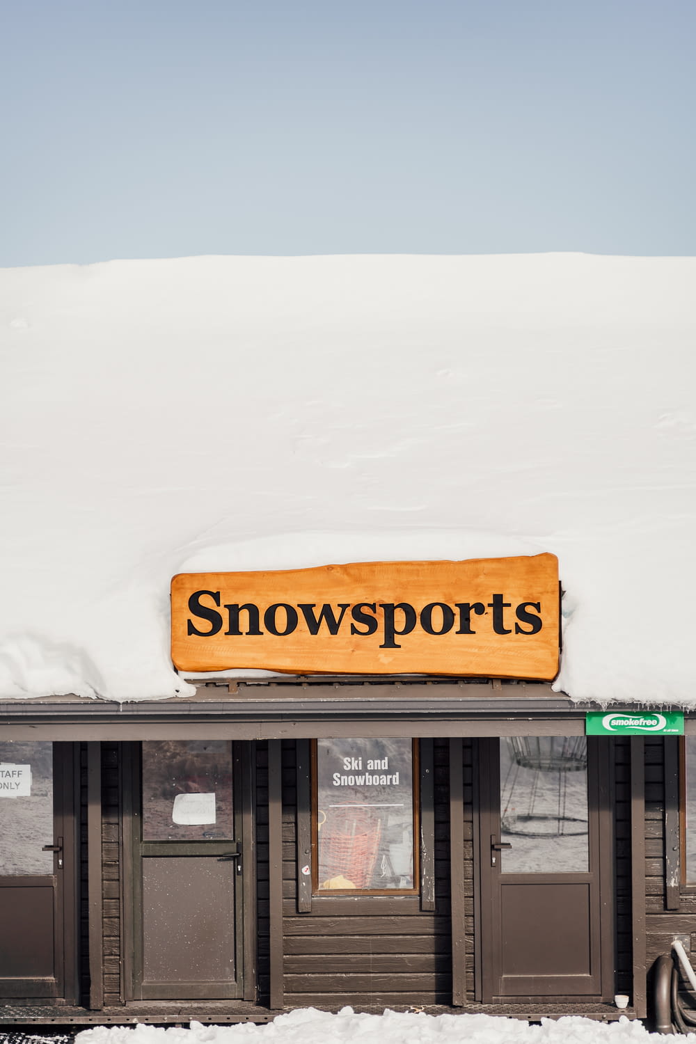 a snow sports store with a sign on the roof