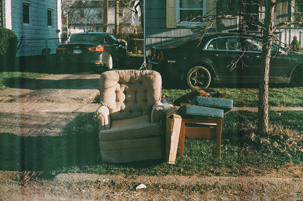a chair and a table in a yard