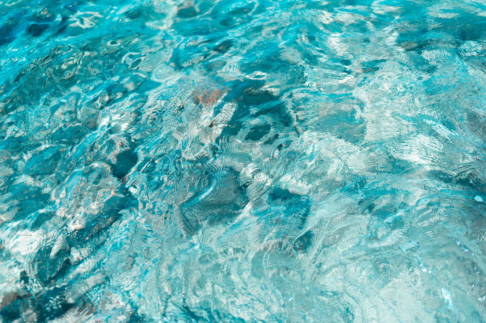 a close up of a pool with clear blue water