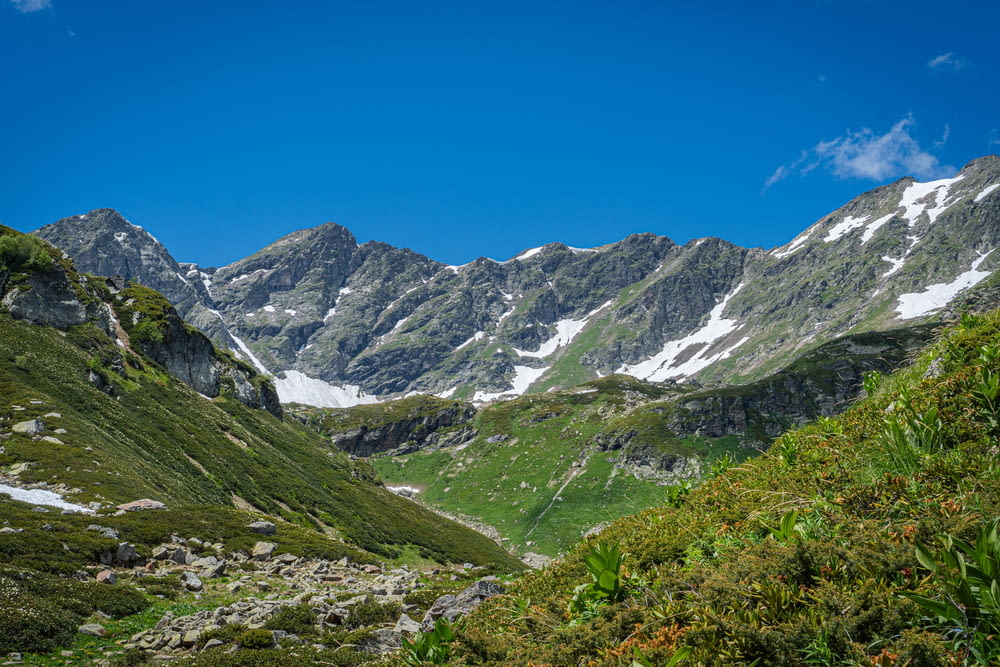 a view of a mountain range from a trail