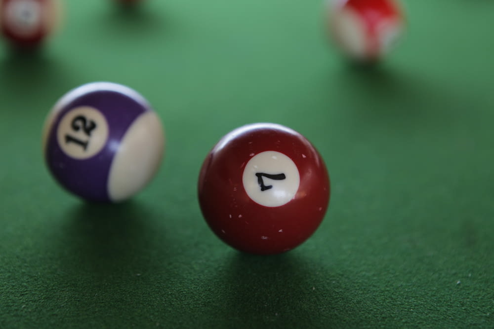 a pool table with two billiards and two balls