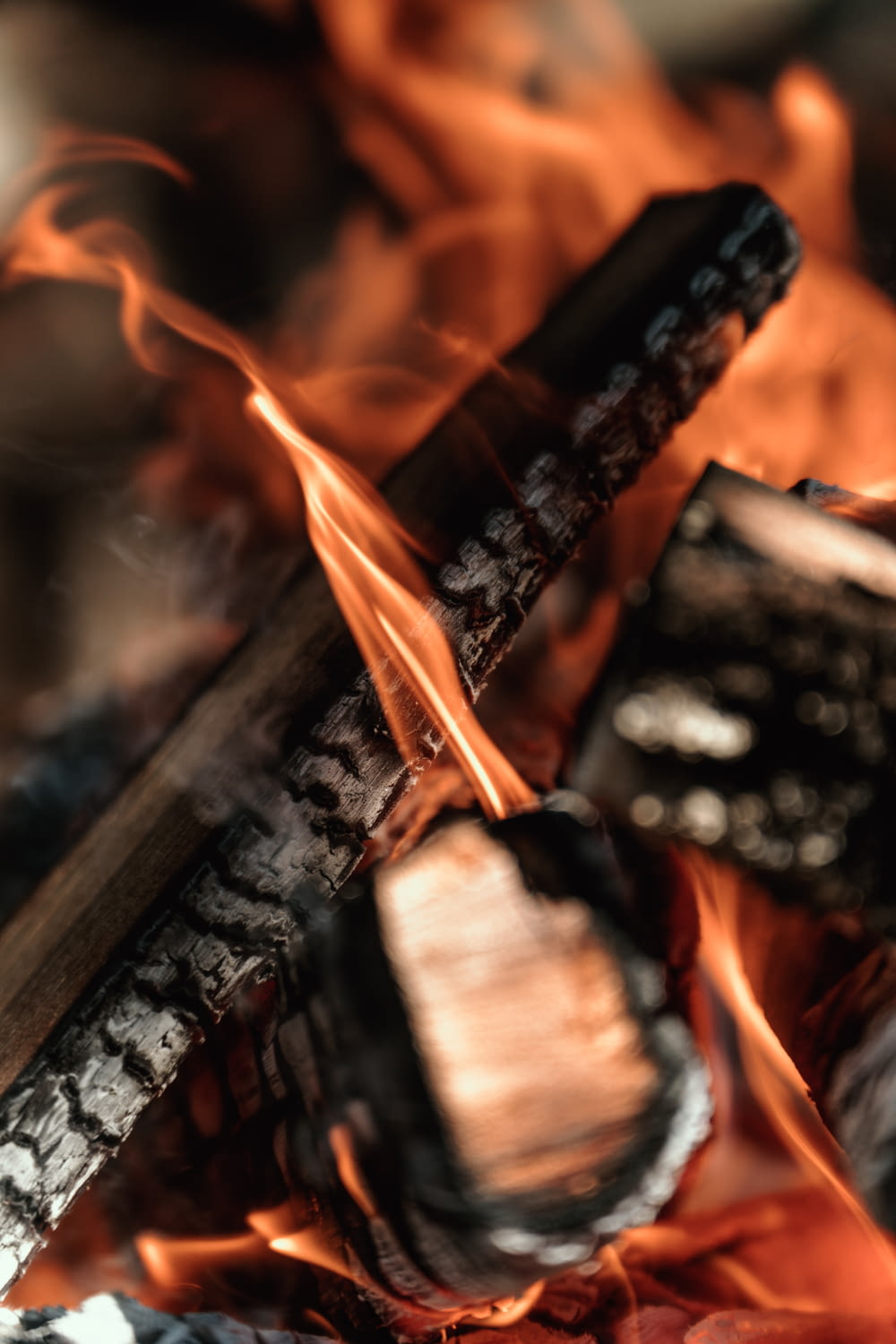 a close up of a cross on fire