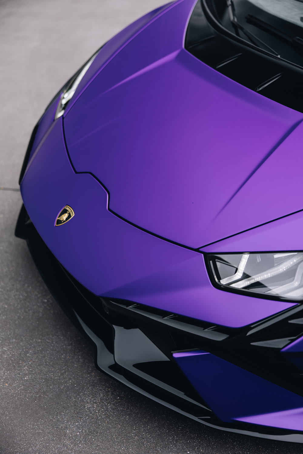 a close up of a purple sports car