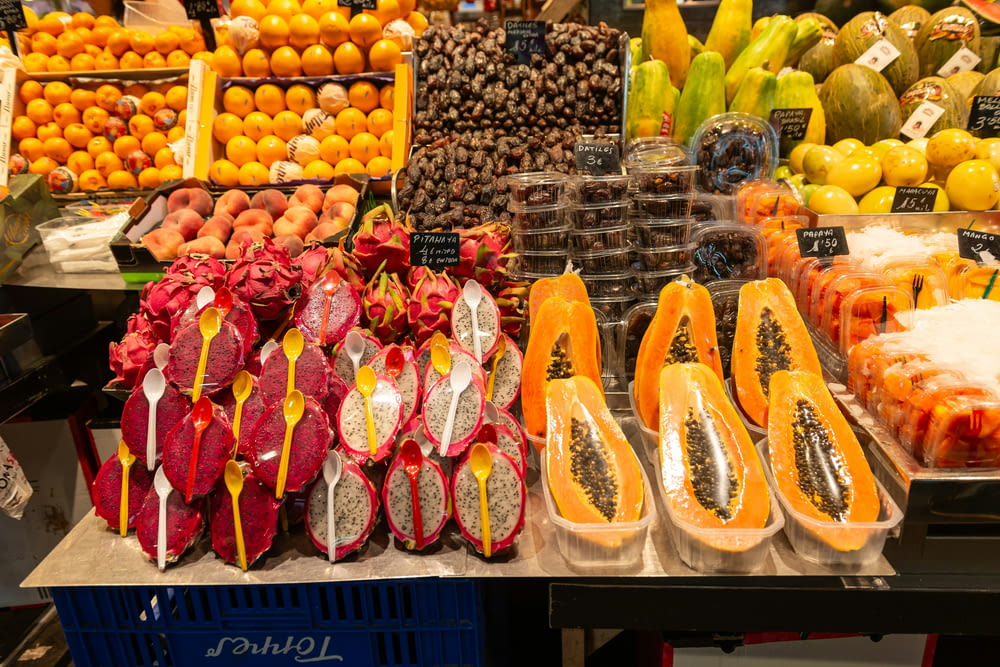 a variety of fruits are on display at a market
