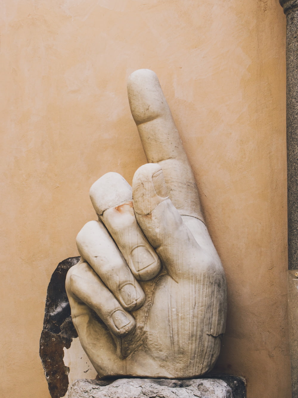 a statue of a hand making the middle finger sign