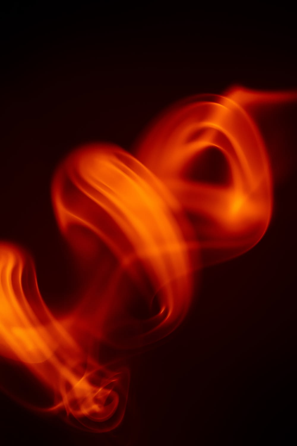 a blurry photo of a red object on a black background