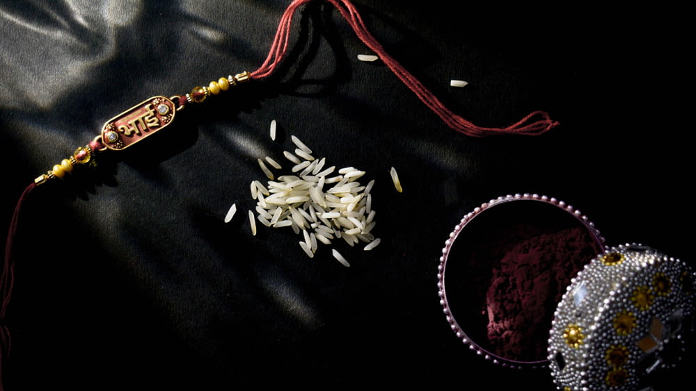 a close up of a tassel and a bowl of rice
