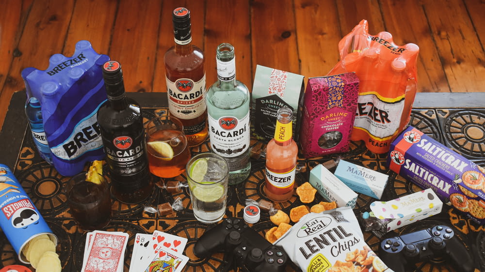 a table topped with lots of different types of liquor