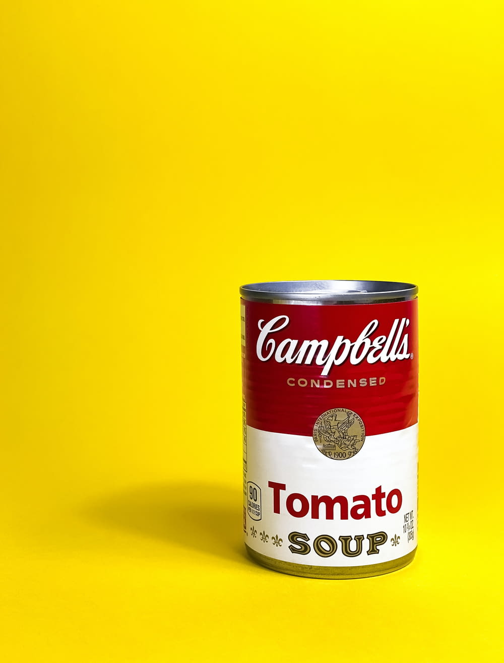 a can of soup on a yellow background