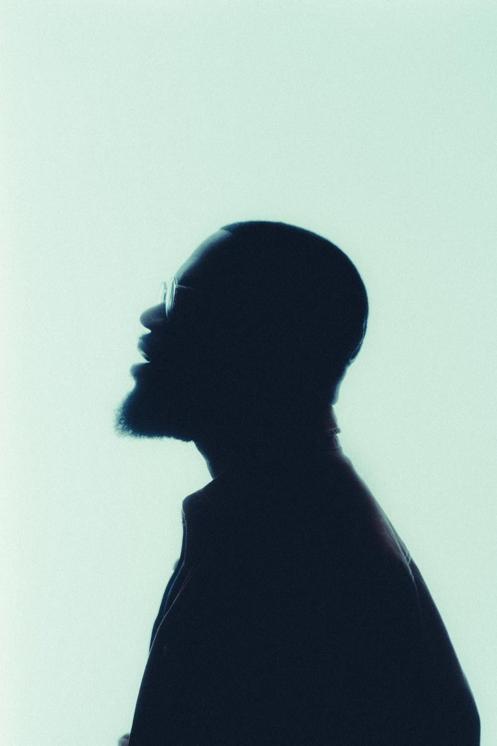 a silhouette of a man with a beard