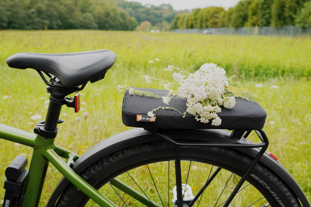a bicycle with a flower arrangement on the seat