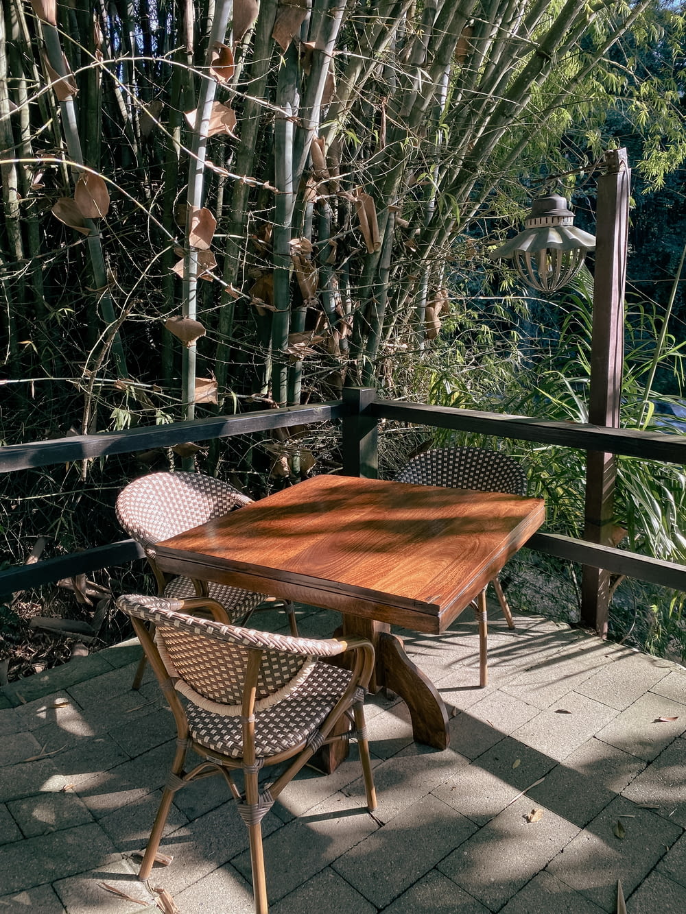 a wooden table sitting on top of a wooden deck