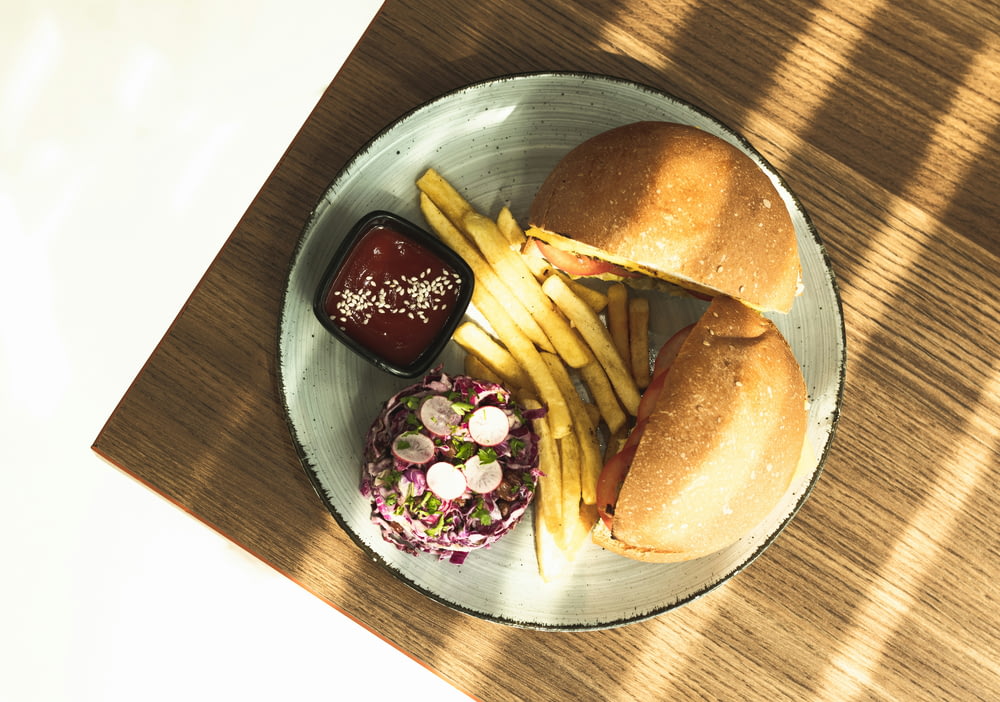 a plate with a sandwich and fries on it