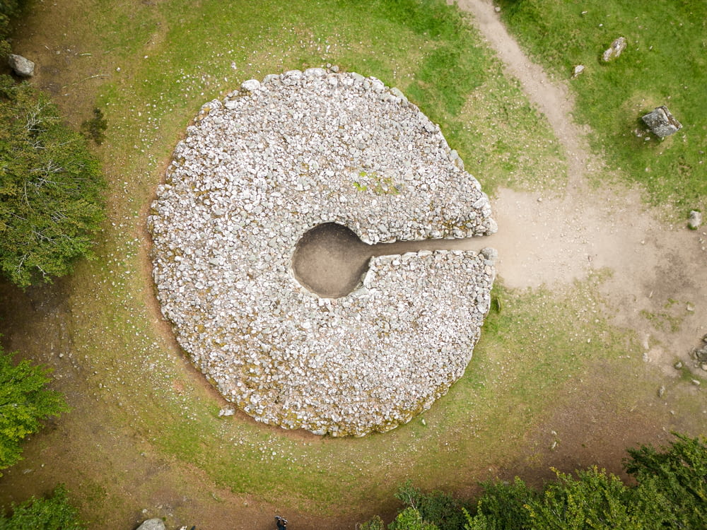 an aerial view of a stone circle in the middle of a field