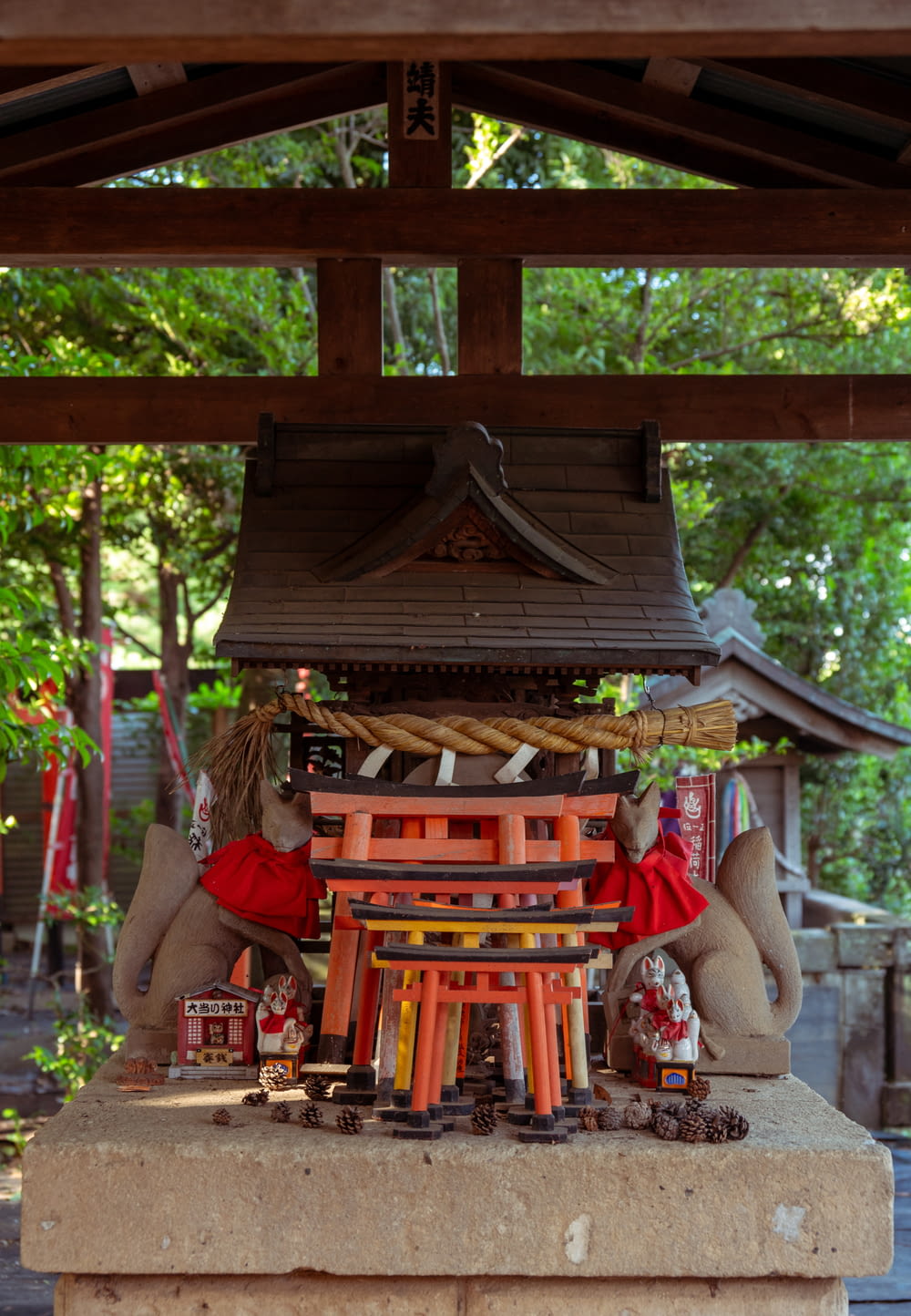 a shrine with a bell and decorations on it