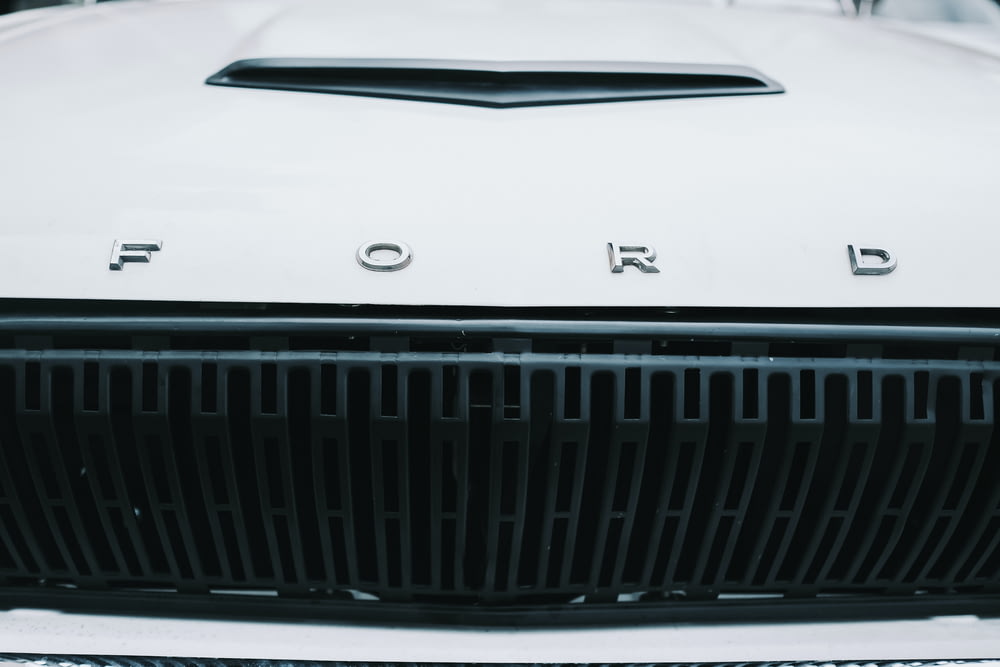 a close up of the front grill of a white car
