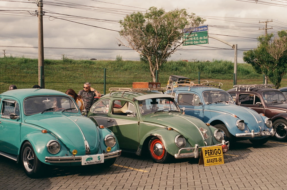 a group of old cars parked next to each other