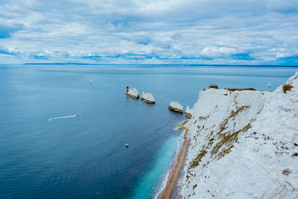 a body of water surrounded by white cliffs