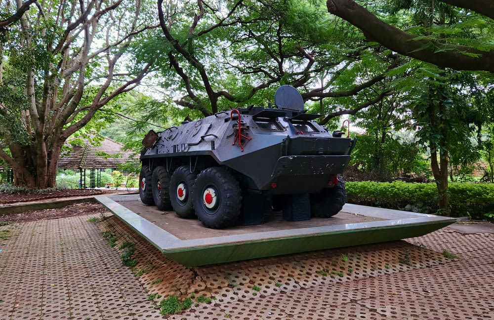 a large armored vehicle on display in a park
