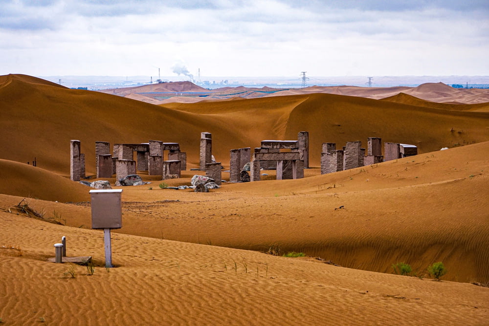 a group of buildings in the middle of a desert
