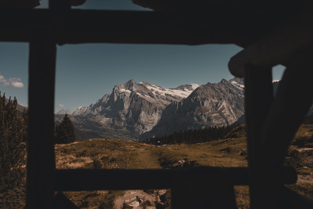 a view of a mountain range from a window