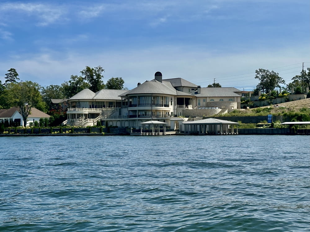 a large house sitting on top of a lake