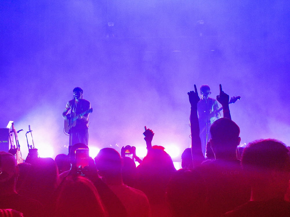 a group of people standing on top of a stage
