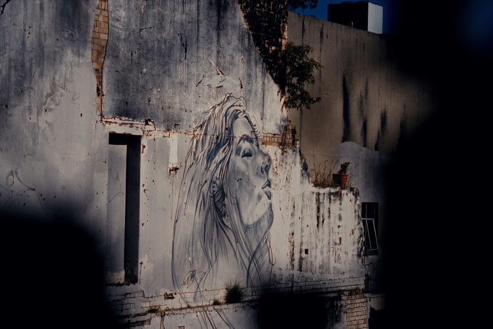 a painting of a horse on the side of a building