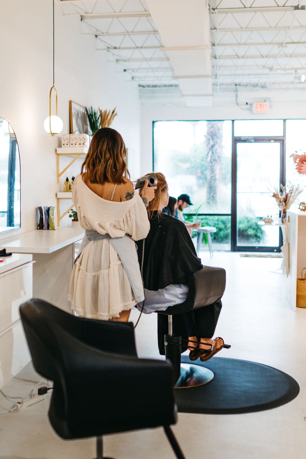 a woman getting her hair done in a salon