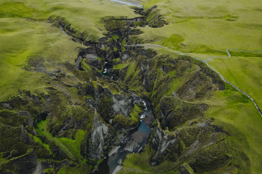 an aerial view of a river running through a valley